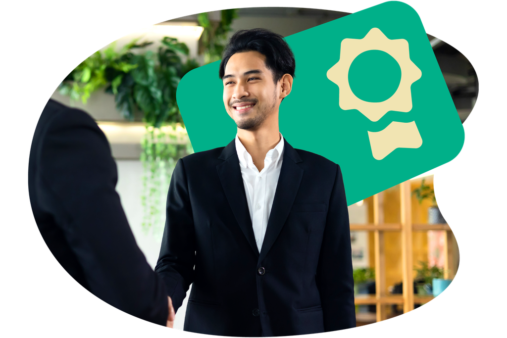 Smiling man in a suit shakes hands in an office, with a certificate icon in the background.